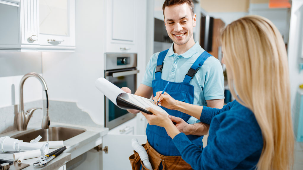 Licensed plumber consulting with homeowner about repair options